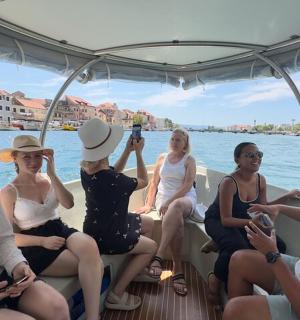 a group of people sitting on a boat