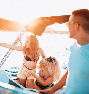 a group of people on a boat in the water