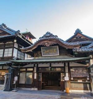 an asian building with a sign on top of it