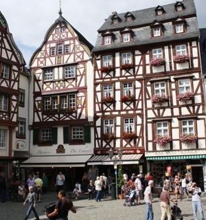 a group of half timbered buildings in a town