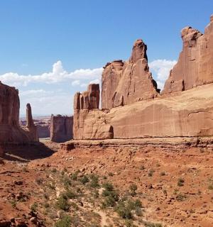 a view of a canyon with rocks and trees