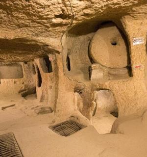 a cave with a stone wall witholithicolithicolithicolithicolithicolithicolithicolithicolithic