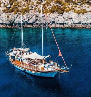 a boat with people on it in the water