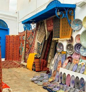 a display of ceramics on a wall in a store