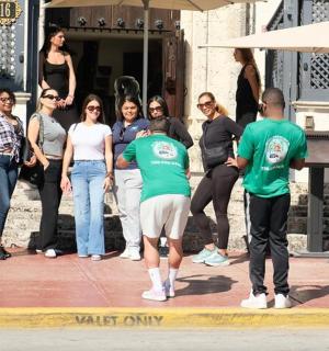 a group of people standing outside of a building