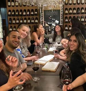 a group of people sitting at a table in a restaurant