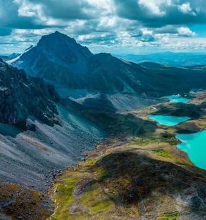 an aerial view of two lakes in a mountain valley