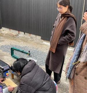 a group of people looking at a video camera