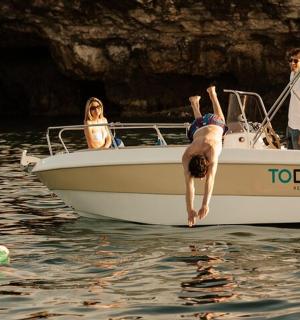 a group of people on a boat in the water