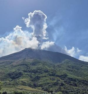 a mountain with smoke coming out of it