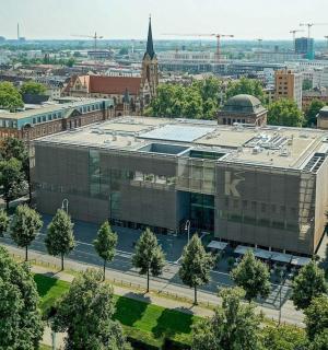 an aerial view of a large building in a city