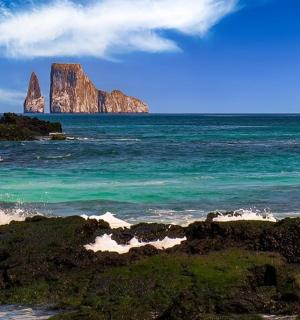 a view of the ocean with two large rocks in the water
