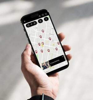 a person holding a cell phone in their hand