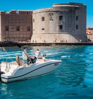a group of people on a boat in the water