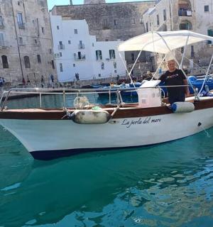 a woman sitting on a boat in the water