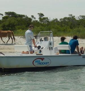 a group of people on a boat in the water