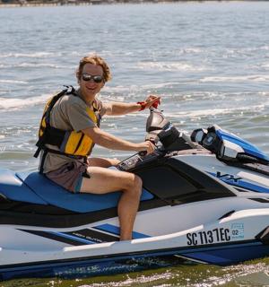 a man sitting on a jet ski in the water
