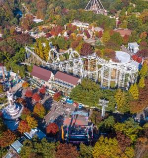 an overhead view of an amusement park with a roller coaster