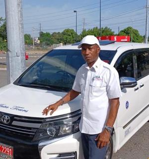 a man standing in front of a police car