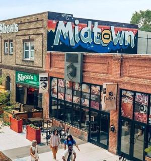 a building with people walking in front of it