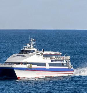 a large ferry boat in the middle of the ocean