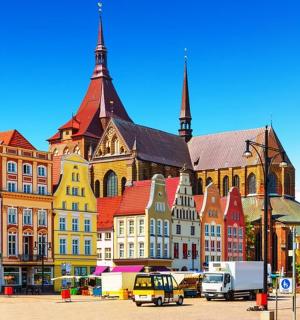 a group of buildings in a city with a street