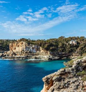 a view of a body of water with a rocky shore