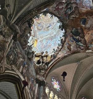 a large church with paintings on the ceiling