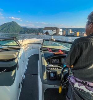 a woman standing on a boat in the water