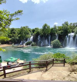 a waterfall in the middle of a river