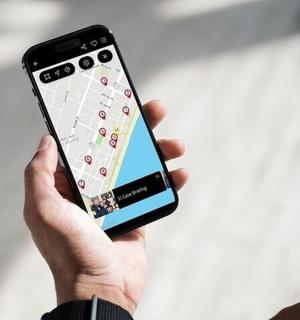 a person holding a cell phone in their hand