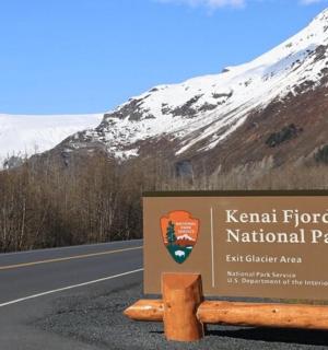 a sign for kanan funds national park on the side of a road