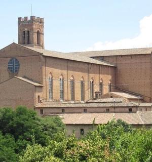 a large brick building with a tower on top of it