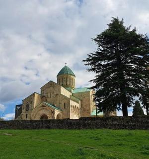a large building with a tree in front of it