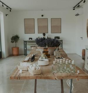 a room with a wooden table with bottles on it