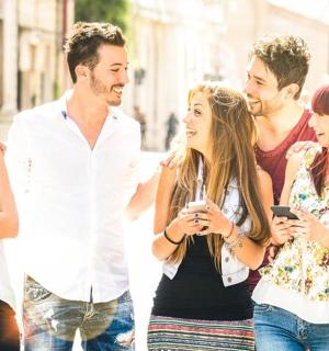 a group of people walking down the street