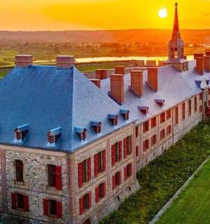 an old building with a tower and a church