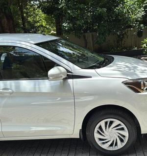 a white car parked on a brick road