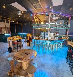 a restaurant with tables and chairs and a bar