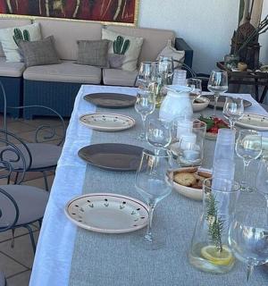 a table with plates and wine glasses on it