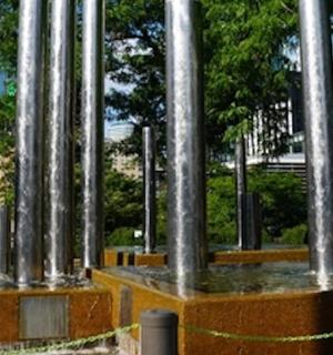 a row of metal poles in a park