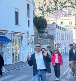 a group of people walking down a city street