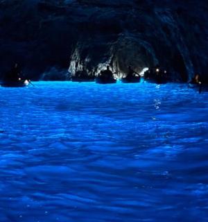 a group of people in a river at night