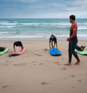 a group of people on the beach with their surfboards