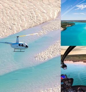 一架直升机飞越海滩和海洋