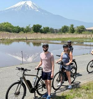 a group of people on bikes with a mountain in the background