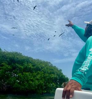a man is flying a kite in the sky