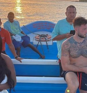 a group of people on a boat on the water