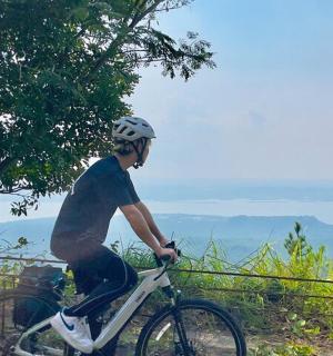a man riding a bike down a hill