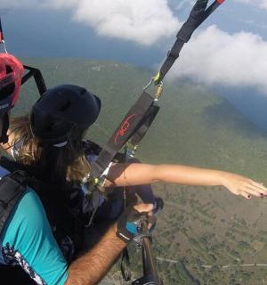 a man and a woman flying in a parachute